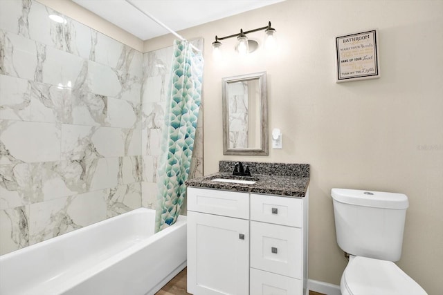 full bathroom with shower / tub combo with curtain, vanity, and toilet