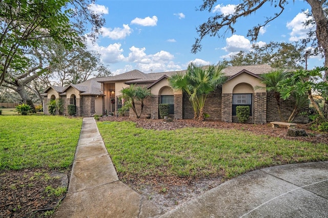 ranch-style home with a front lawn