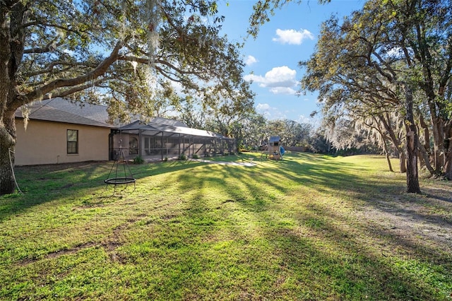 view of yard with a lanai