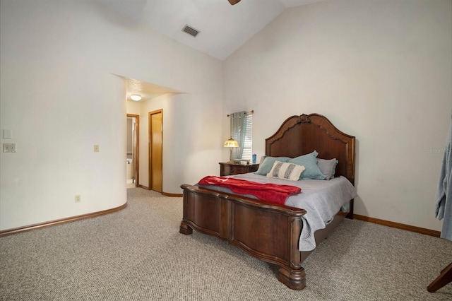 bedroom with ceiling fan, light carpet, and vaulted ceiling