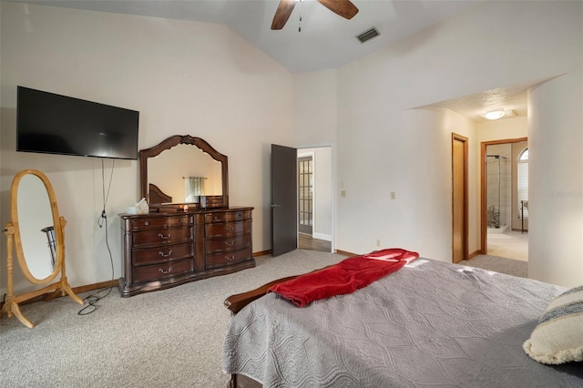 bedroom with ensuite bath, light colored carpet, vaulted ceiling, and ceiling fan