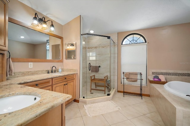 bathroom featuring tile patterned flooring, vanity, and plus walk in shower