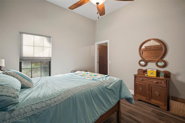 bedroom featuring ceiling fan and dark wood-type flooring