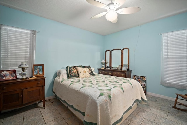 tiled bedroom with ceiling fan