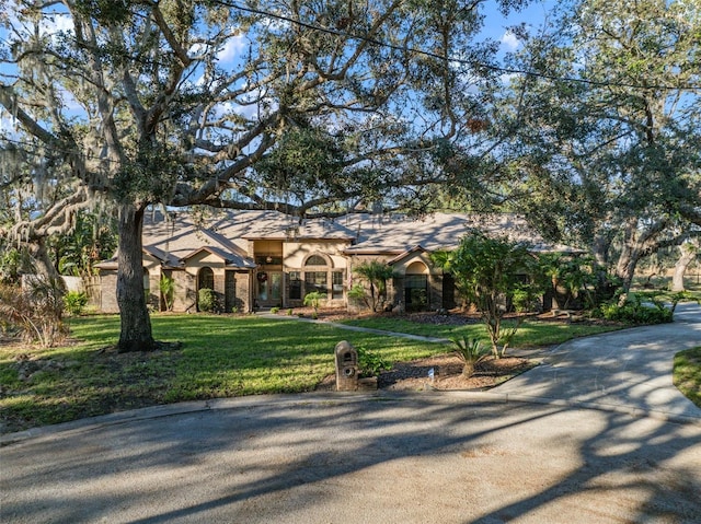 view of front of home with a front yard