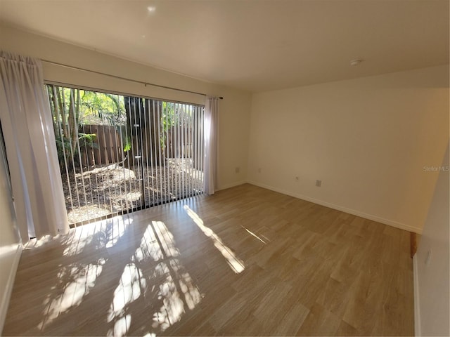 spare room featuring hardwood / wood-style flooring