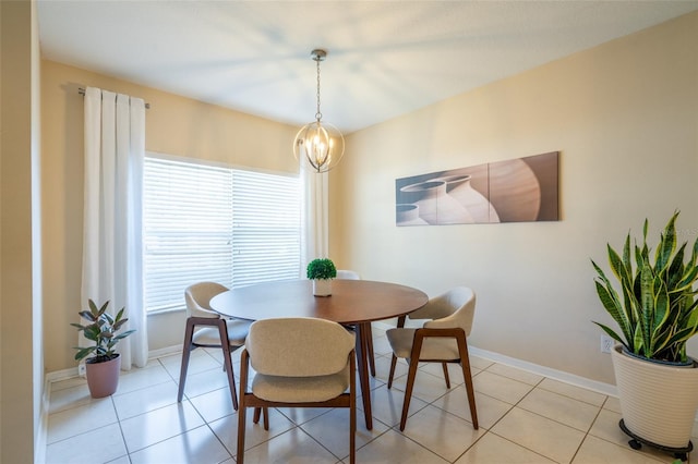 dining space featuring a chandelier and light tile patterned floors