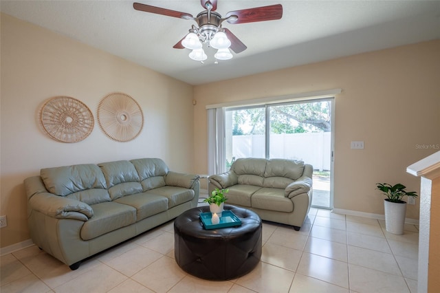 living room featuring ceiling fan and light tile patterned flooring