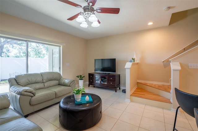 tiled living room with ceiling fan