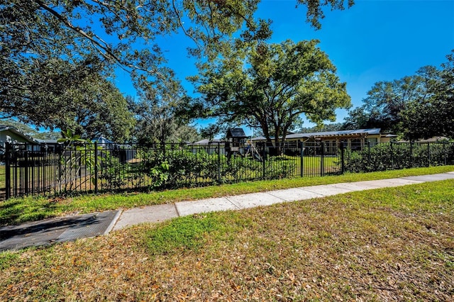 exterior space with a yard and fence