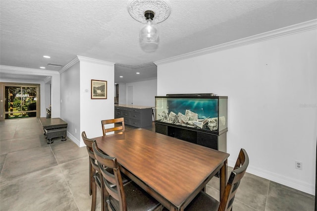 dining area with visible vents, crown molding, a textured ceiling, and baseboards