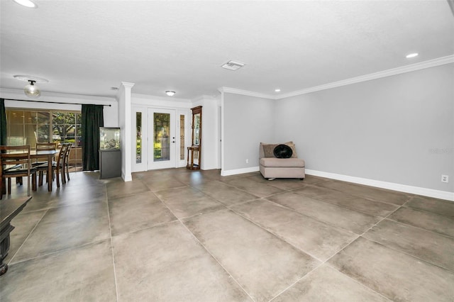 unfurnished room with baseboards, visible vents, a textured ceiling, crown molding, and recessed lighting