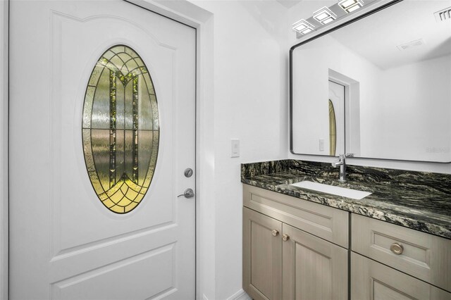 bathroom with visible vents and vanity