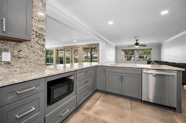 kitchen featuring a peninsula, gray cabinets, stainless steel dishwasher, black microwave, and a sink