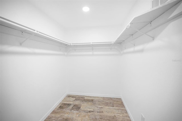 walk in closet with visible vents