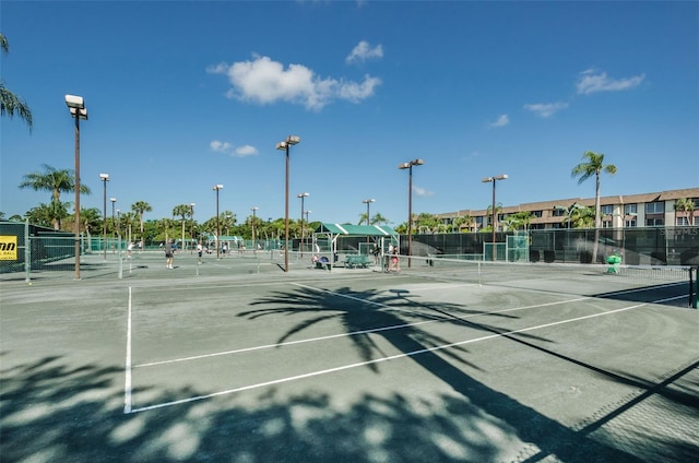 view of tennis court with fence