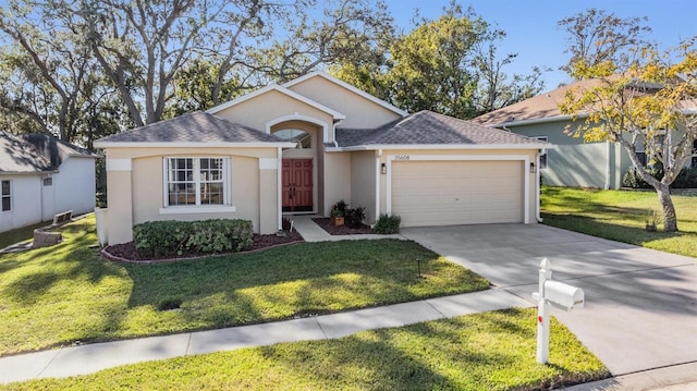 single story home featuring a front yard and a garage