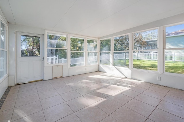 unfurnished sunroom featuring a wealth of natural light