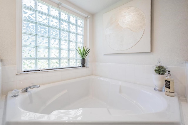 full bath with a garden tub