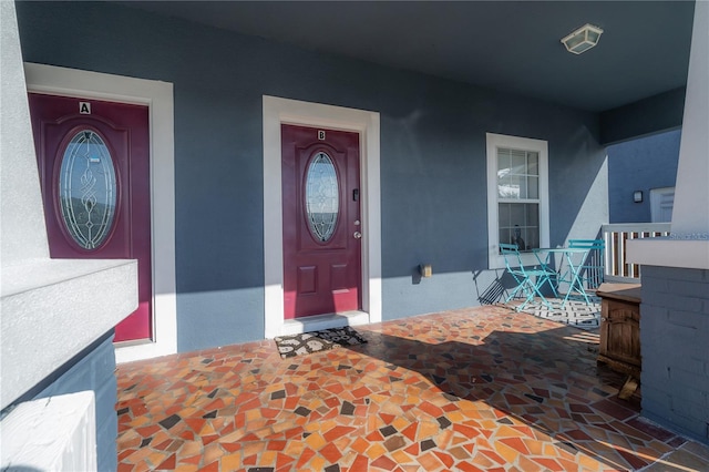 doorway to property with covered porch