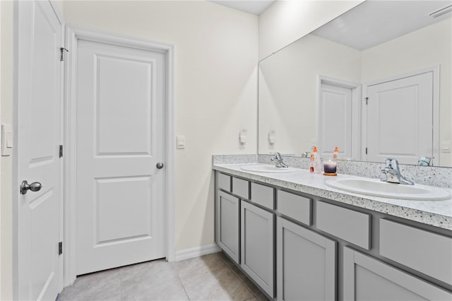 bathroom featuring tile patterned flooring and vanity