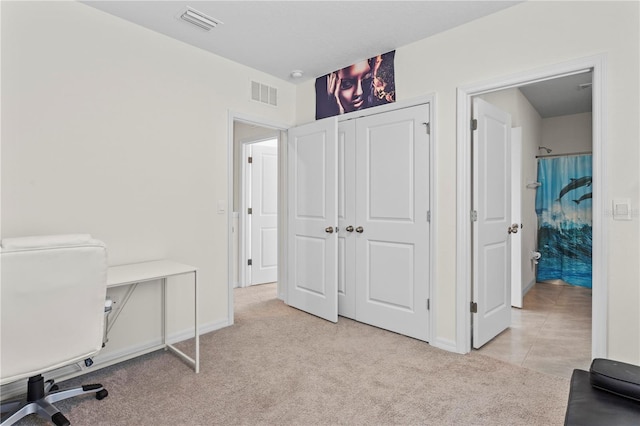 office area featuring light carpet