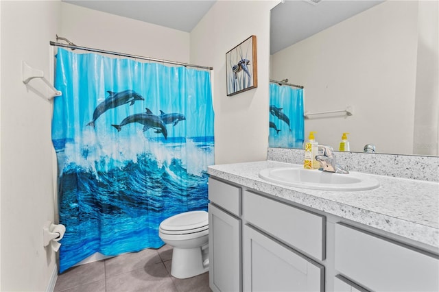 bathroom with vanity, tile patterned floors, and toilet