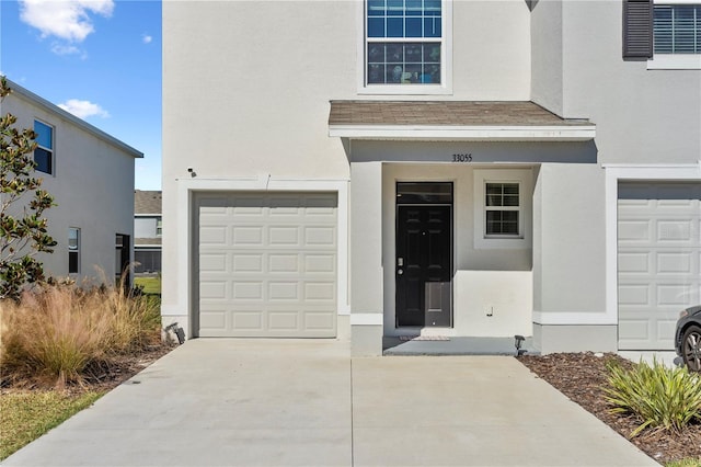 doorway to property featuring a garage