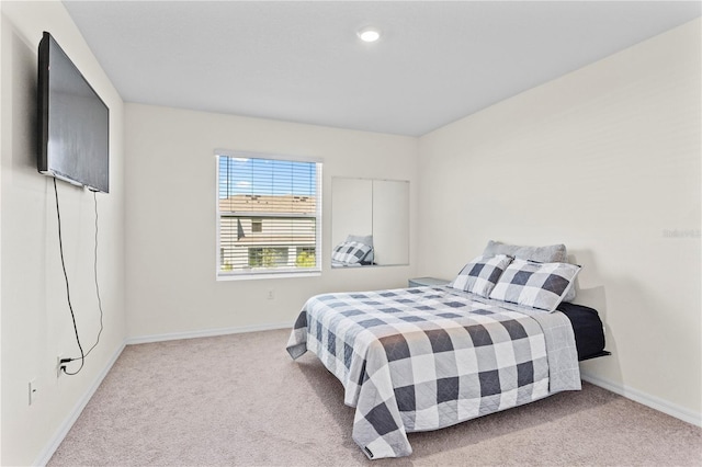 bedroom with light carpet