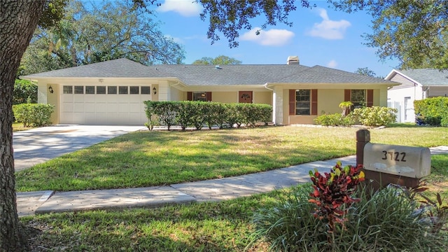 single story home with a front yard and a garage