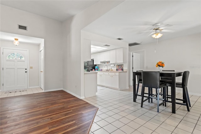 interior space featuring sink and ceiling fan