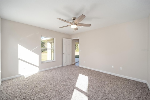 unfurnished room featuring carpet flooring and ceiling fan