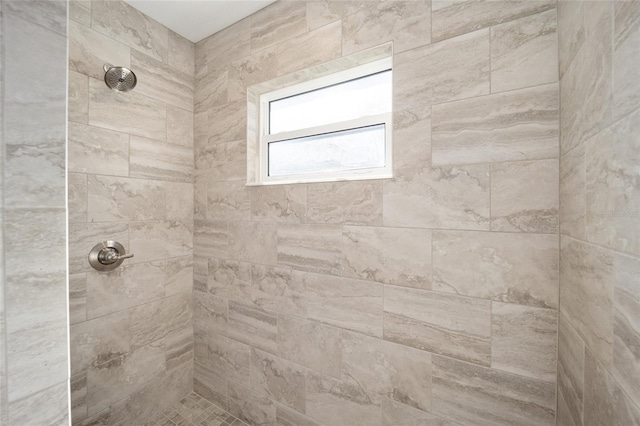 bathroom featuring tiled shower