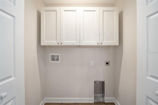 washroom featuring hookup for an electric dryer, cabinets, and hookup for a washing machine