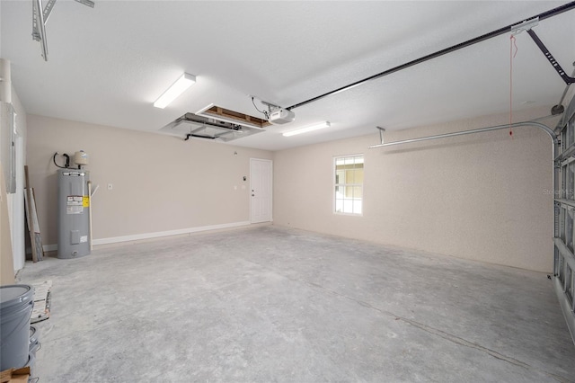 garage featuring water heater and a garage door opener