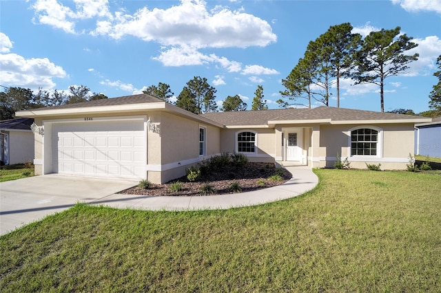 single story home featuring a front lawn and a garage