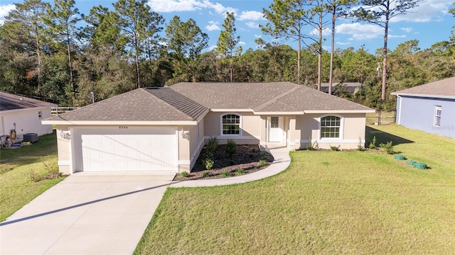 ranch-style house with central air condition unit, a front yard, and a garage