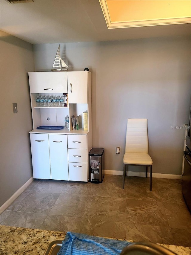 bar with white cabinetry