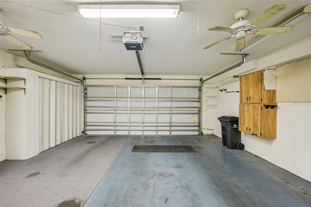 garage with a garage door opener and ceiling fan