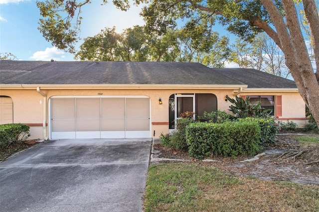 ranch-style home featuring a garage