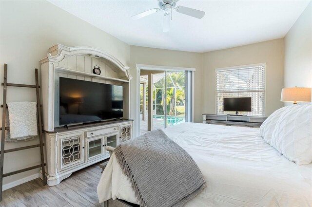 bedroom featuring access to exterior, ceiling fan, and light hardwood / wood-style flooring