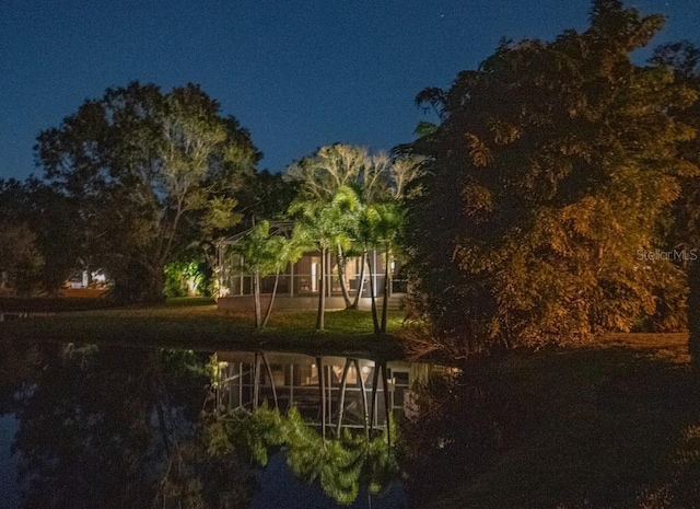 view of back house at twilight