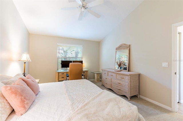 carpeted bedroom featuring ceiling fan and vaulted ceiling