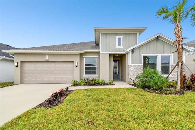 view of front of house with a garage and a front yard