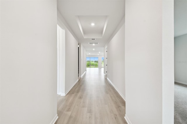 hall with light hardwood / wood-style floors