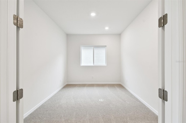 spare room with light carpet