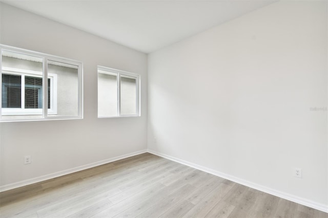 unfurnished room with light hardwood / wood-style flooring