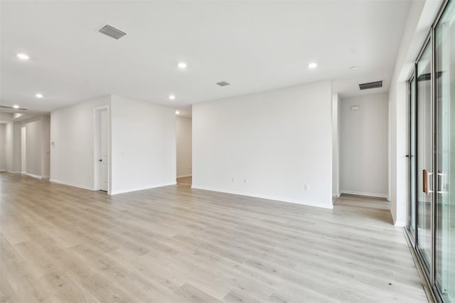 spare room featuring light wood-type flooring