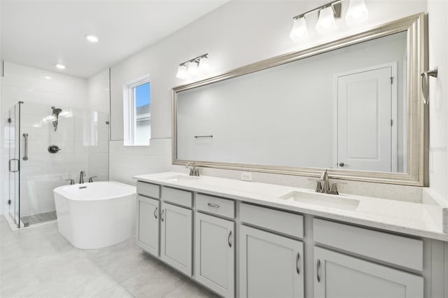 bathroom featuring tile patterned floors, vanity, and independent shower and bath