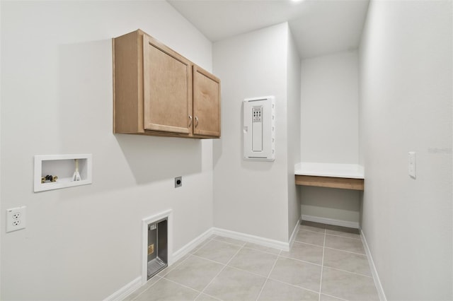 laundry room with washer hookup, electric dryer hookup, cabinets, and light tile patterned floors